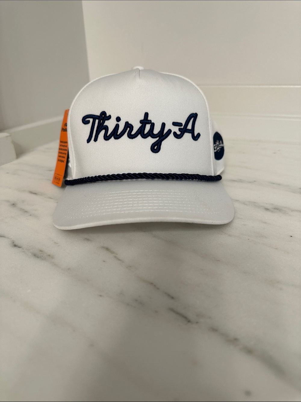 White Trucker Hat with Navy Script Thirty A. New